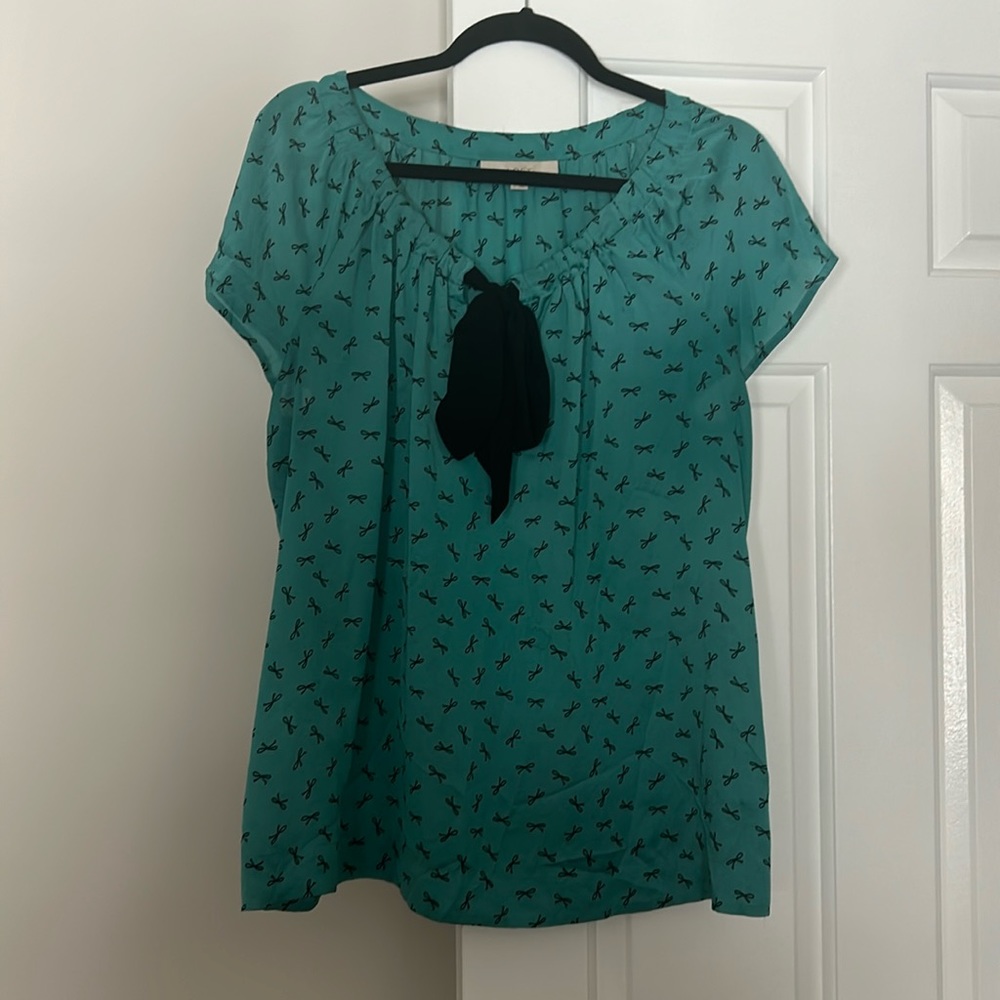 Used good condition loft blouse with fun blue and bow design